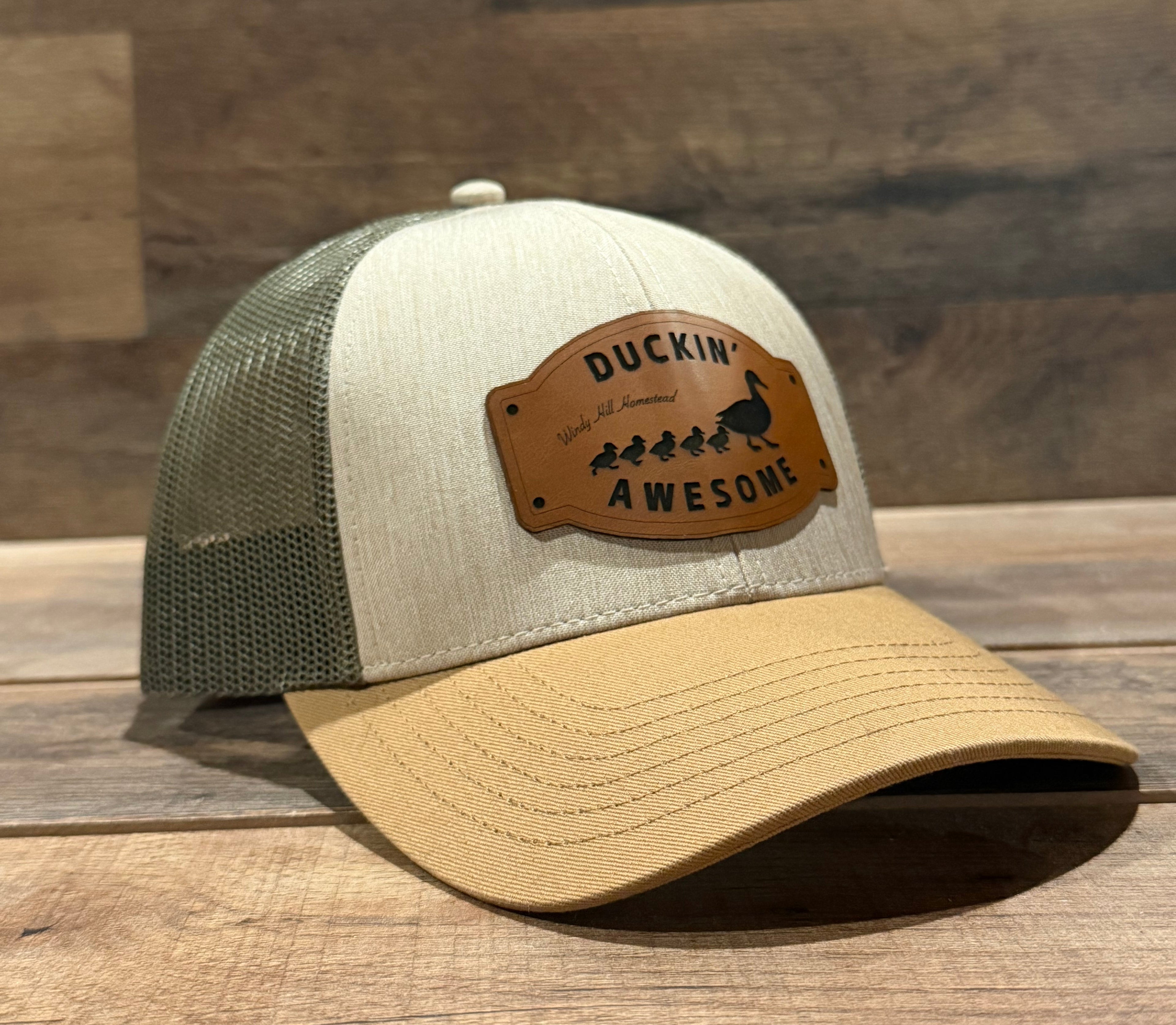 Cap with a leather patch on a wooden surface