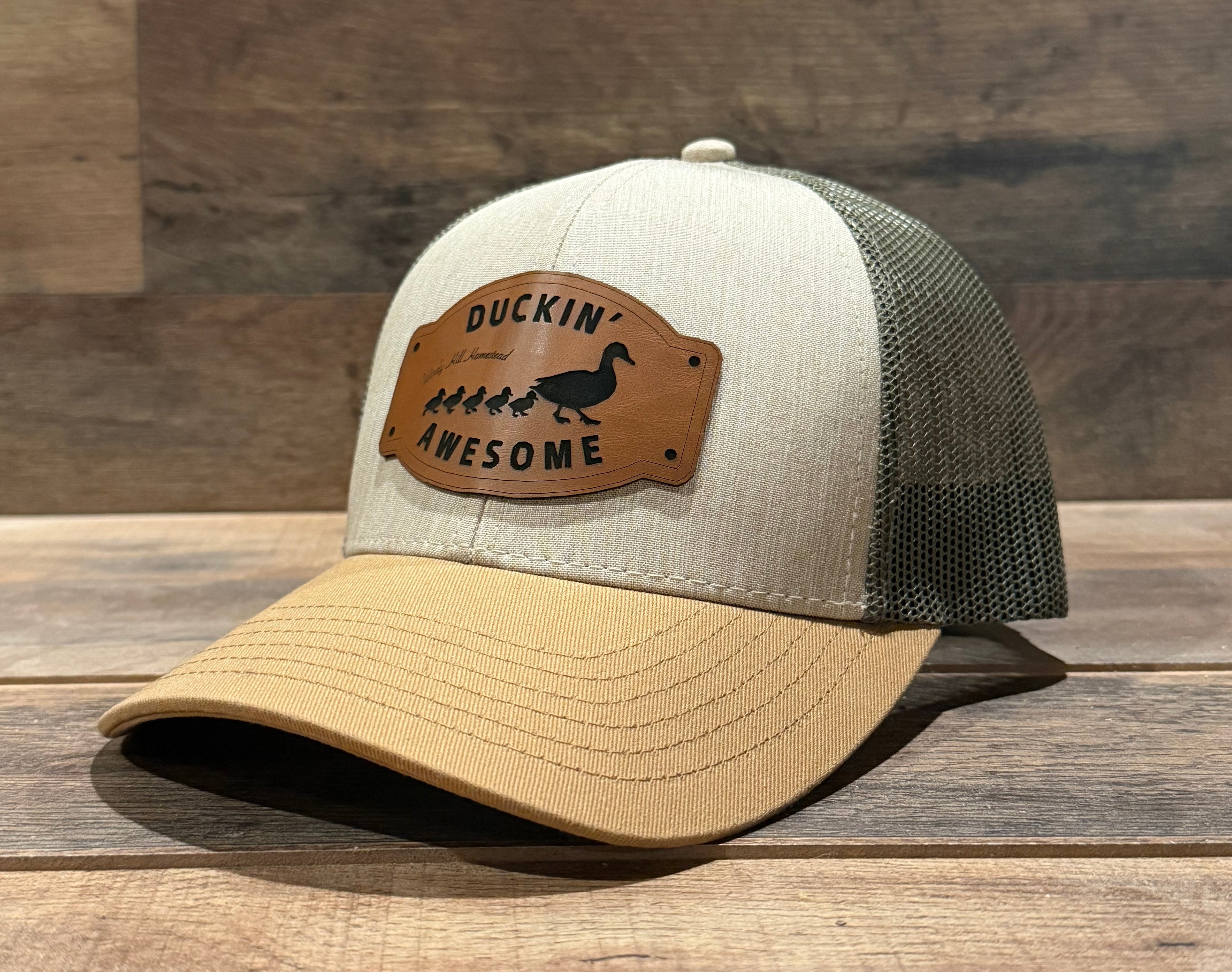 Trucker hat with a leather patch on a wooden surface
