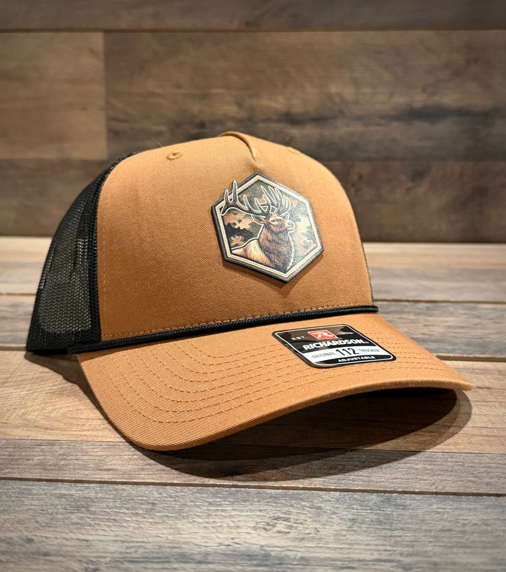Brown trucker cap with a patch on a wooden surface