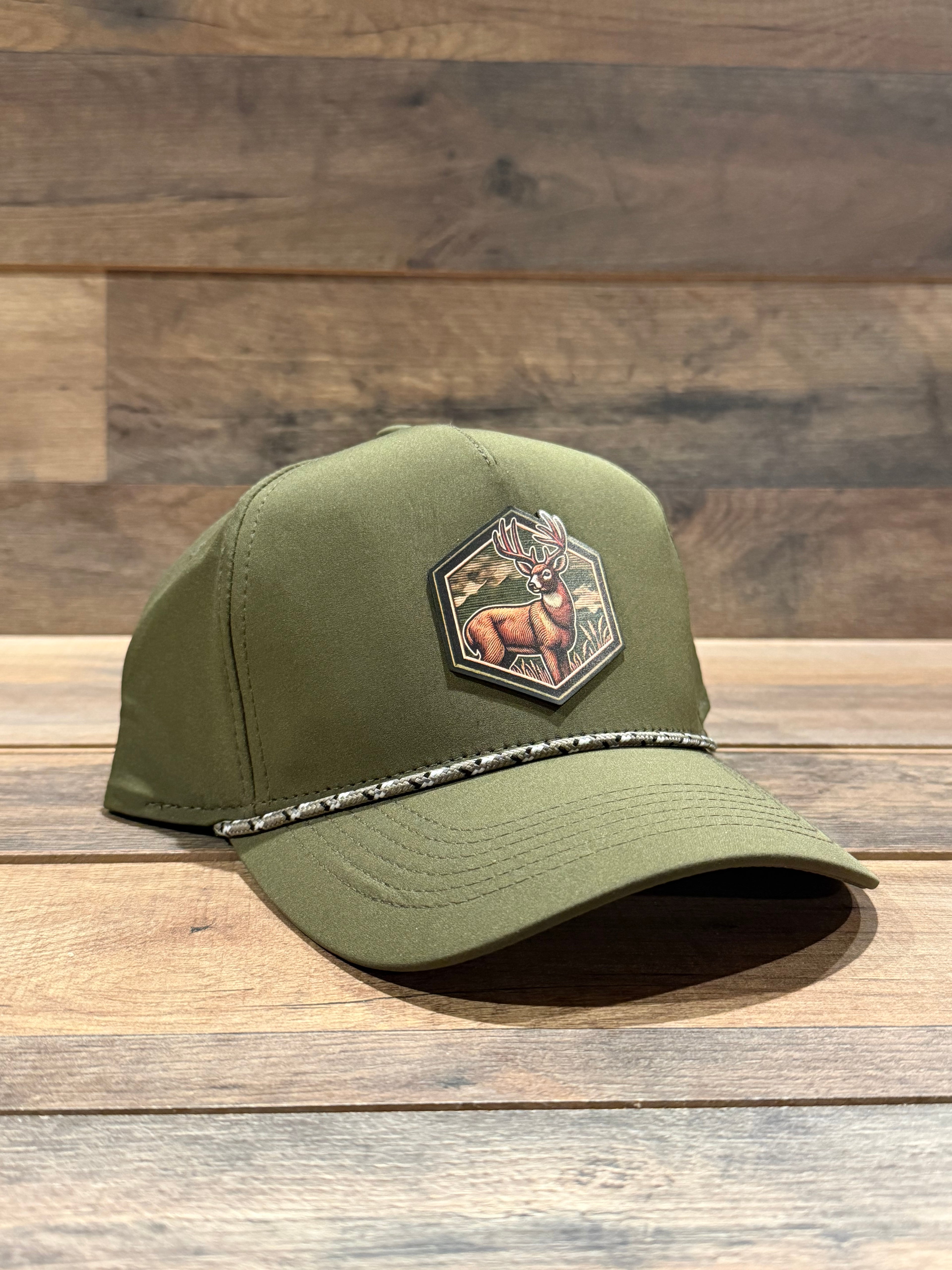 Green cap with a patch on a wooden surface