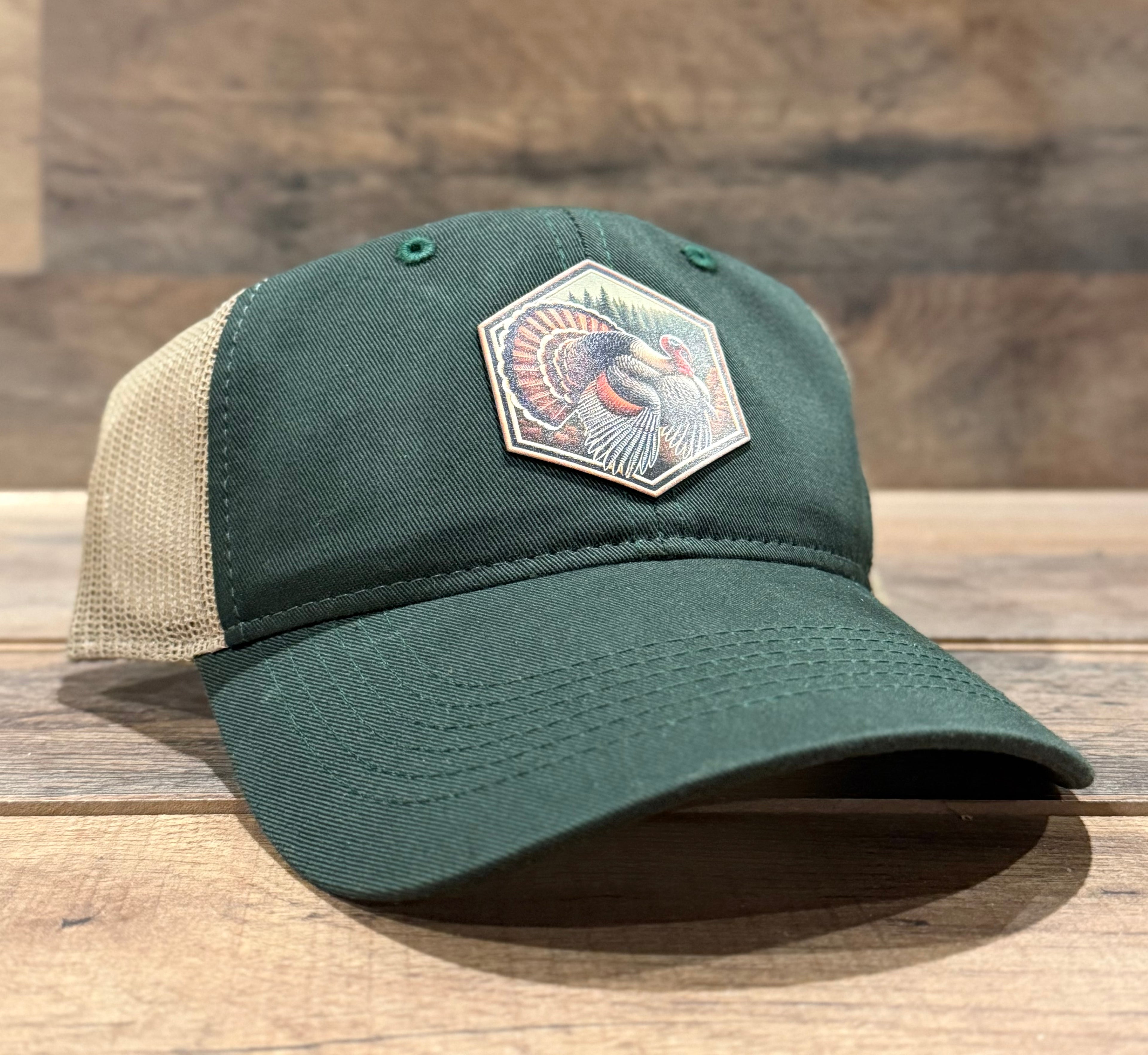 Green cap with a patch on a wooden surface
