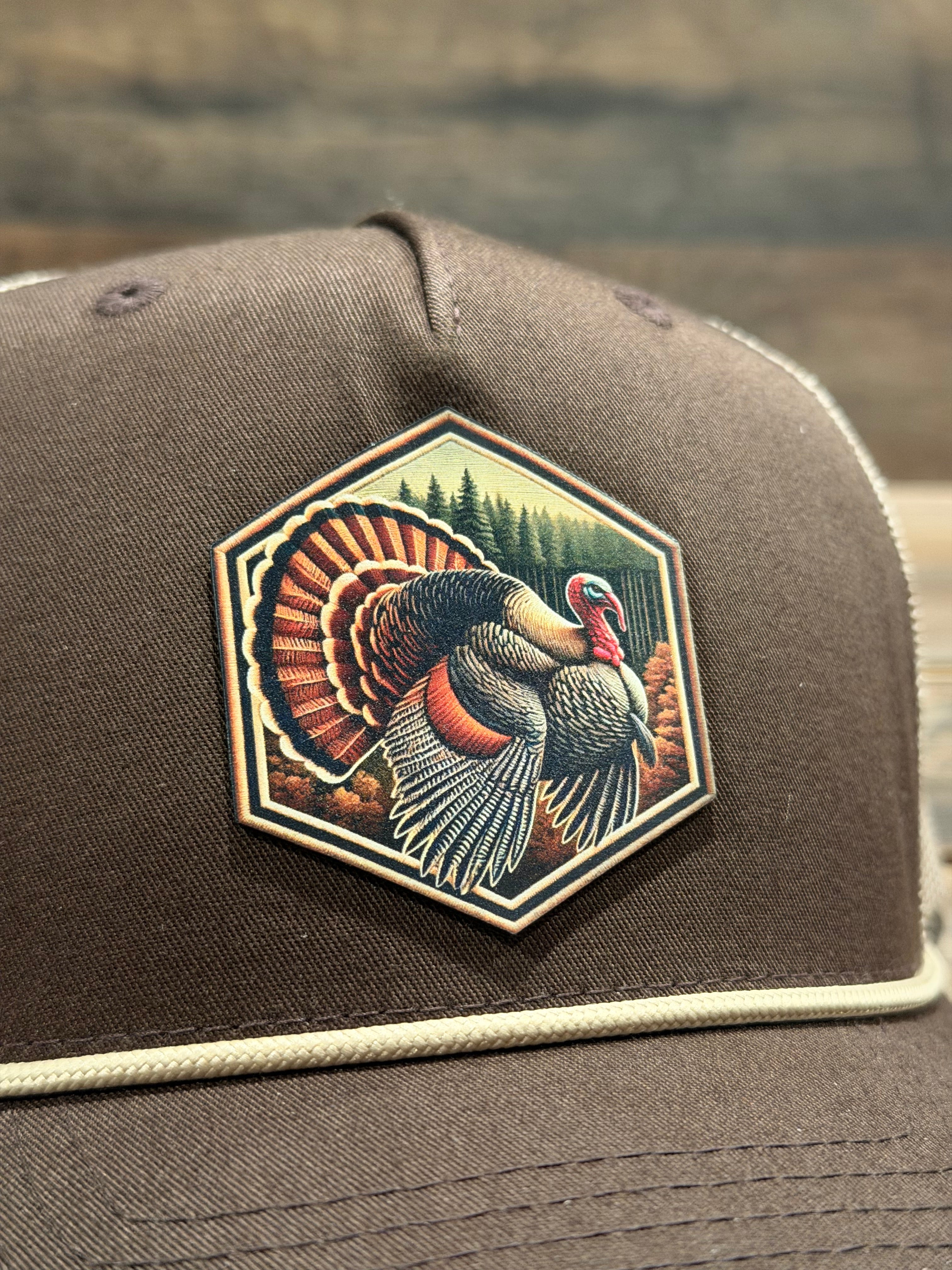 Hexagonal patch with a bird design on a brown jacket