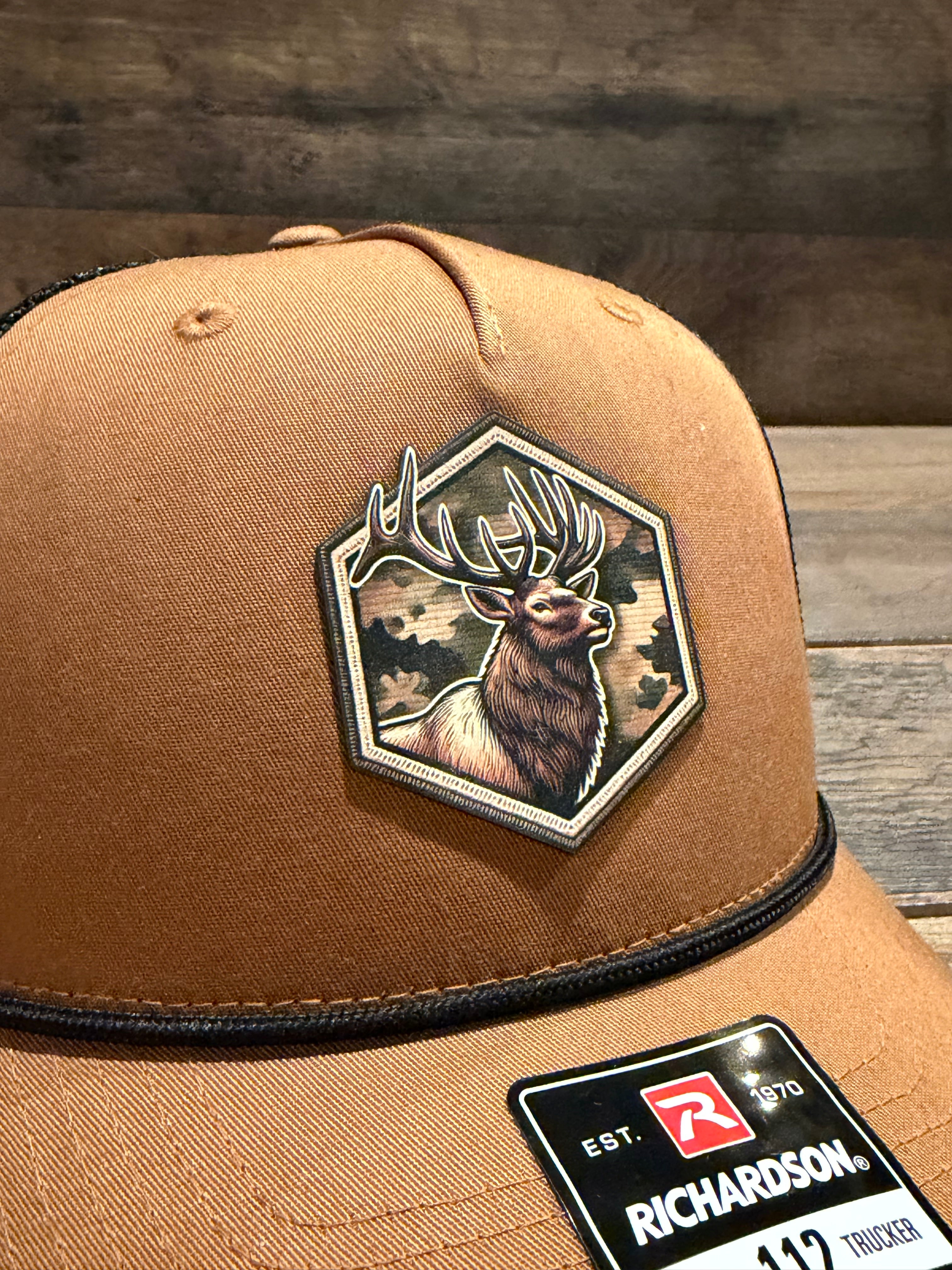 Tan cap with a bear patch and Richardson logo on a wooden surface