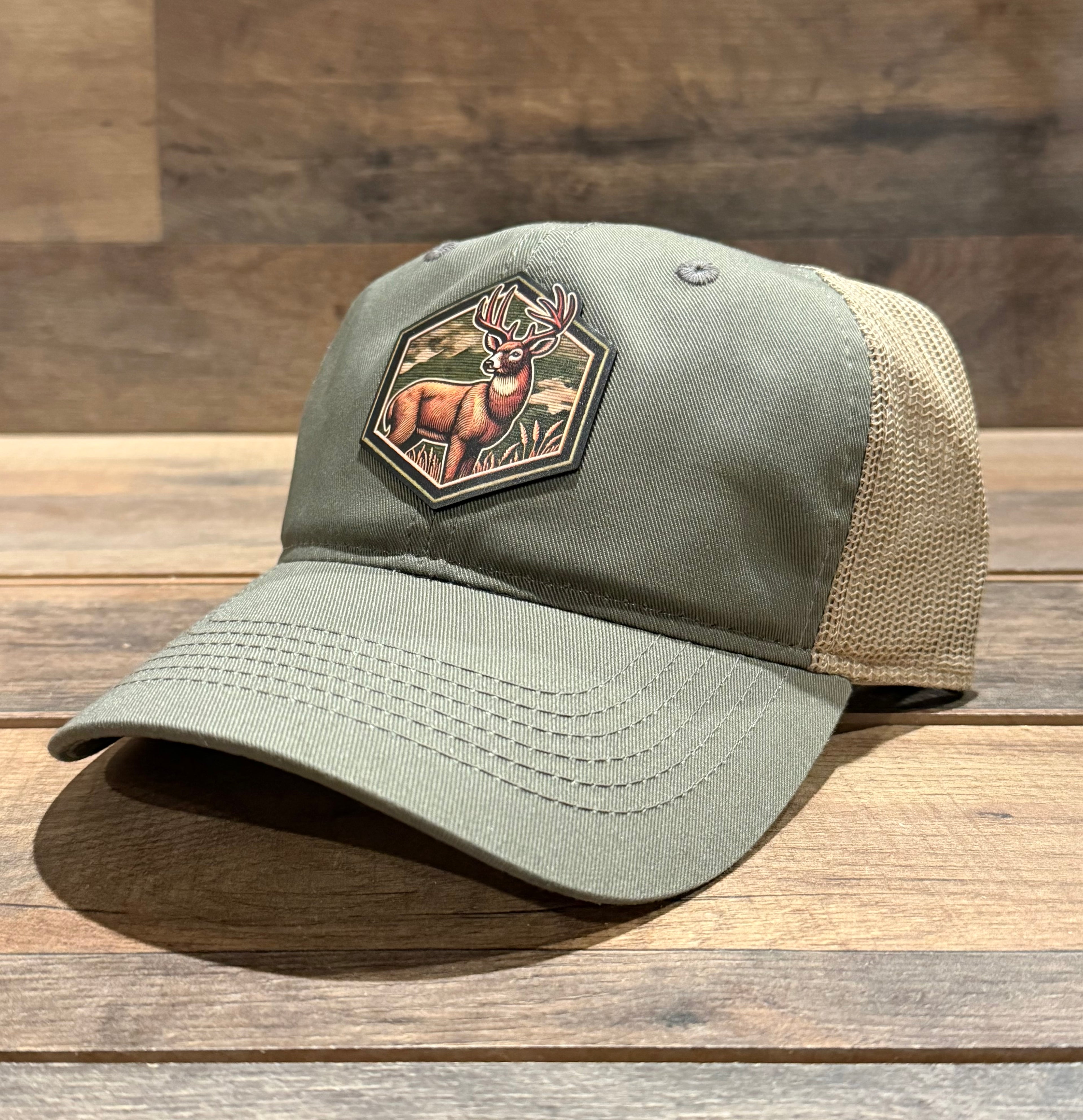 Green cap with a deer patch on a wooden surface